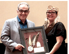 Anishinabek Nation Grand Council Chief Linda Debassige presents Sam Laskaris with his Excellence in Journalism Award.